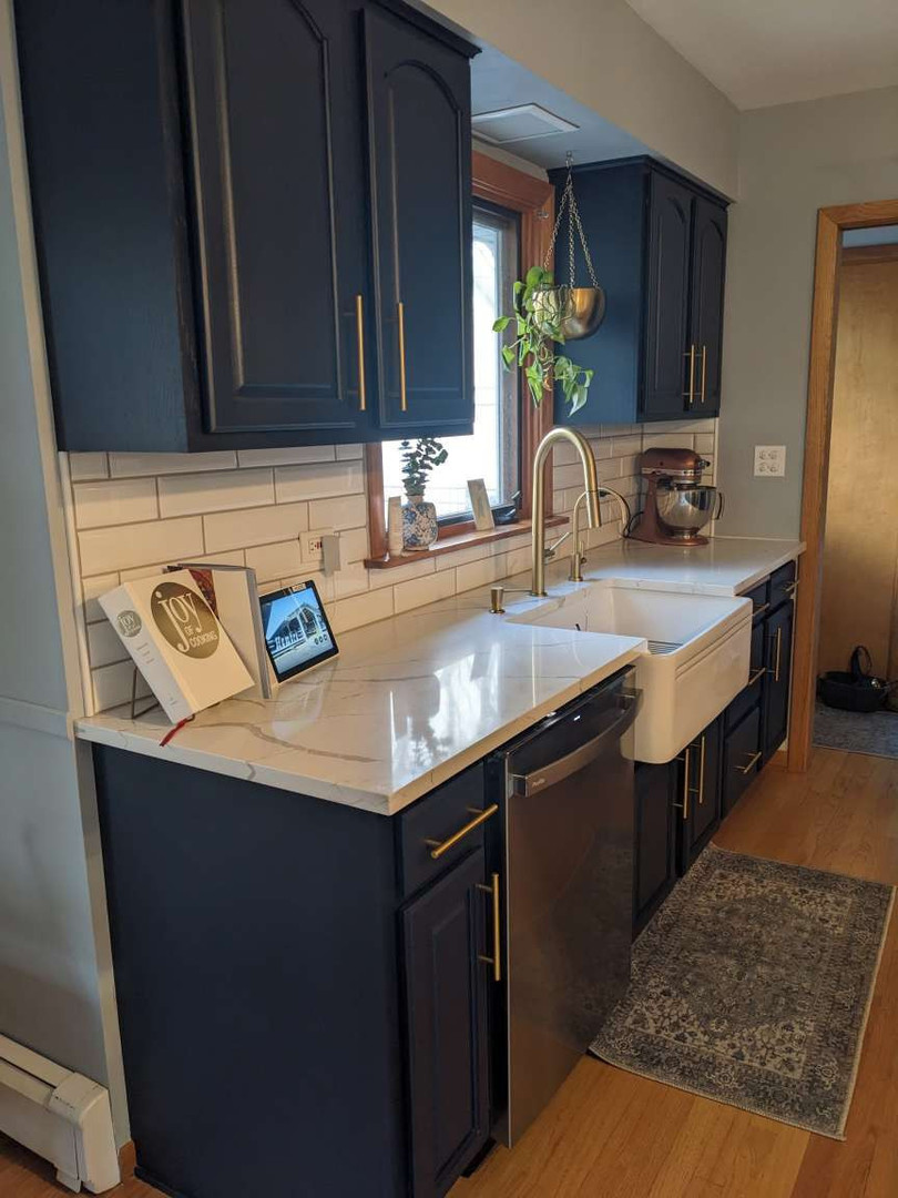 N352 Willow Road Wheaton, IL 60187 - Photo 6 of 25 a kitchen with stainless steel appliances granite countertop a sink a stove and cabinets