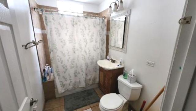 Undisclosed Address Chicago, IL 60641 - Photo 13 of 20 a bathroom with a sink toilet and shower