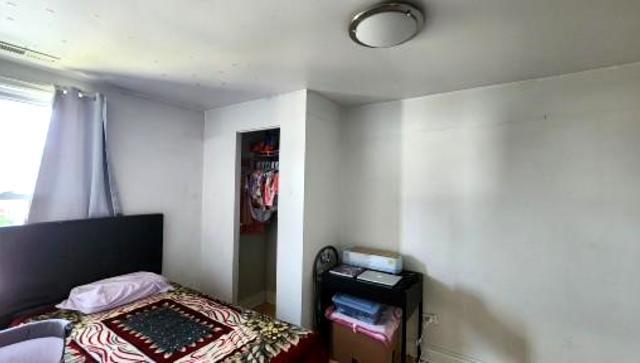 Undisclosed Address Chicago, IL 60641 - Photo 14 of 20 a living room with furniture