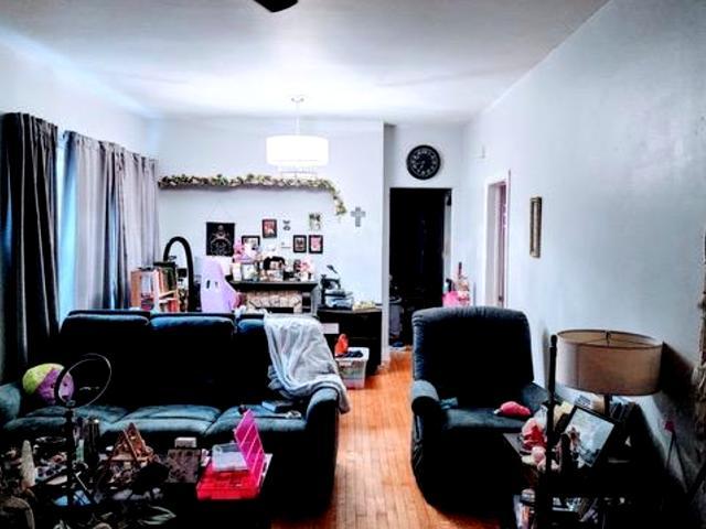 Undisclosed Address Chicago, IL 60641 - Photo 2 of 20 a living room with furniture and a flat screen tv