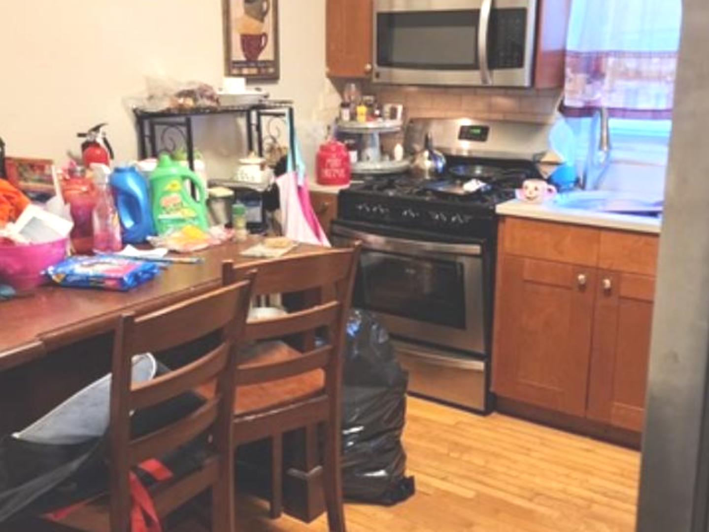 Undisclosed Address Chicago, IL 60641 - Photo 4 of 20 a kitchen with stainless steel appliances granite countertop a stove and a sink