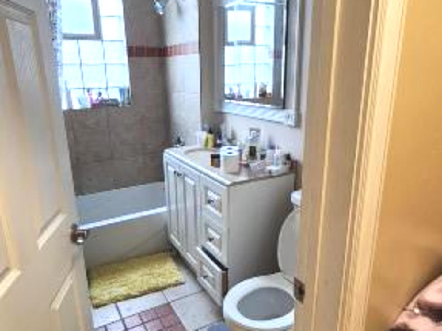 Undisclosed Address Chicago, IL 60641 - Photo 5 of 20 a bathroom with a sink toilet and tub