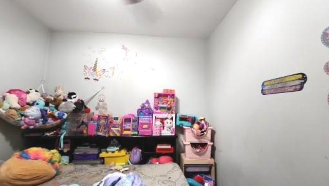 Undisclosed Address Chicago, IL 60641 - Photo 6 of 20 a bedroom with a bed and a couch