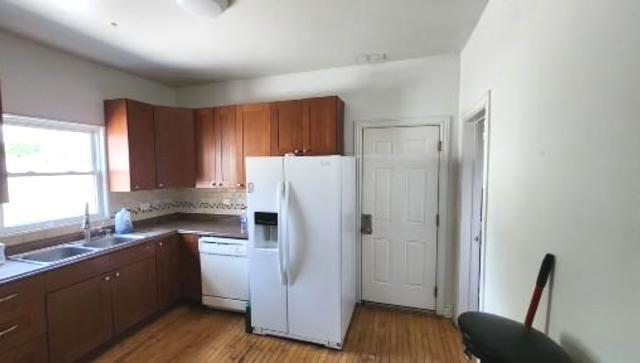 Undisclosed Address Chicago, IL 60641 - Photo 10 of 20 a kitchen with a refrigerator a sink and cabinets