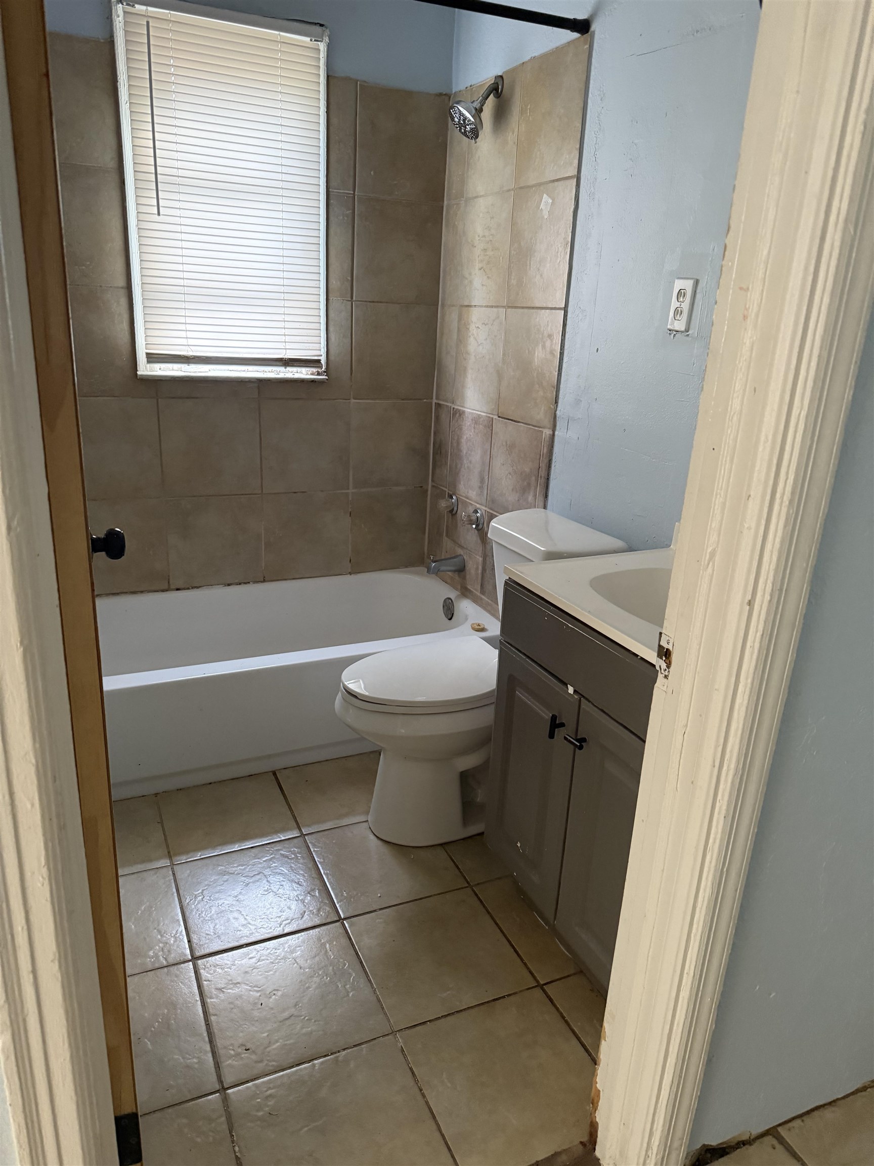 1248 Meda Street Memphis, TN 38114 - Photo 13 of 24 Bathroom with vanity, shower / bath combination, and light tile patterned floors