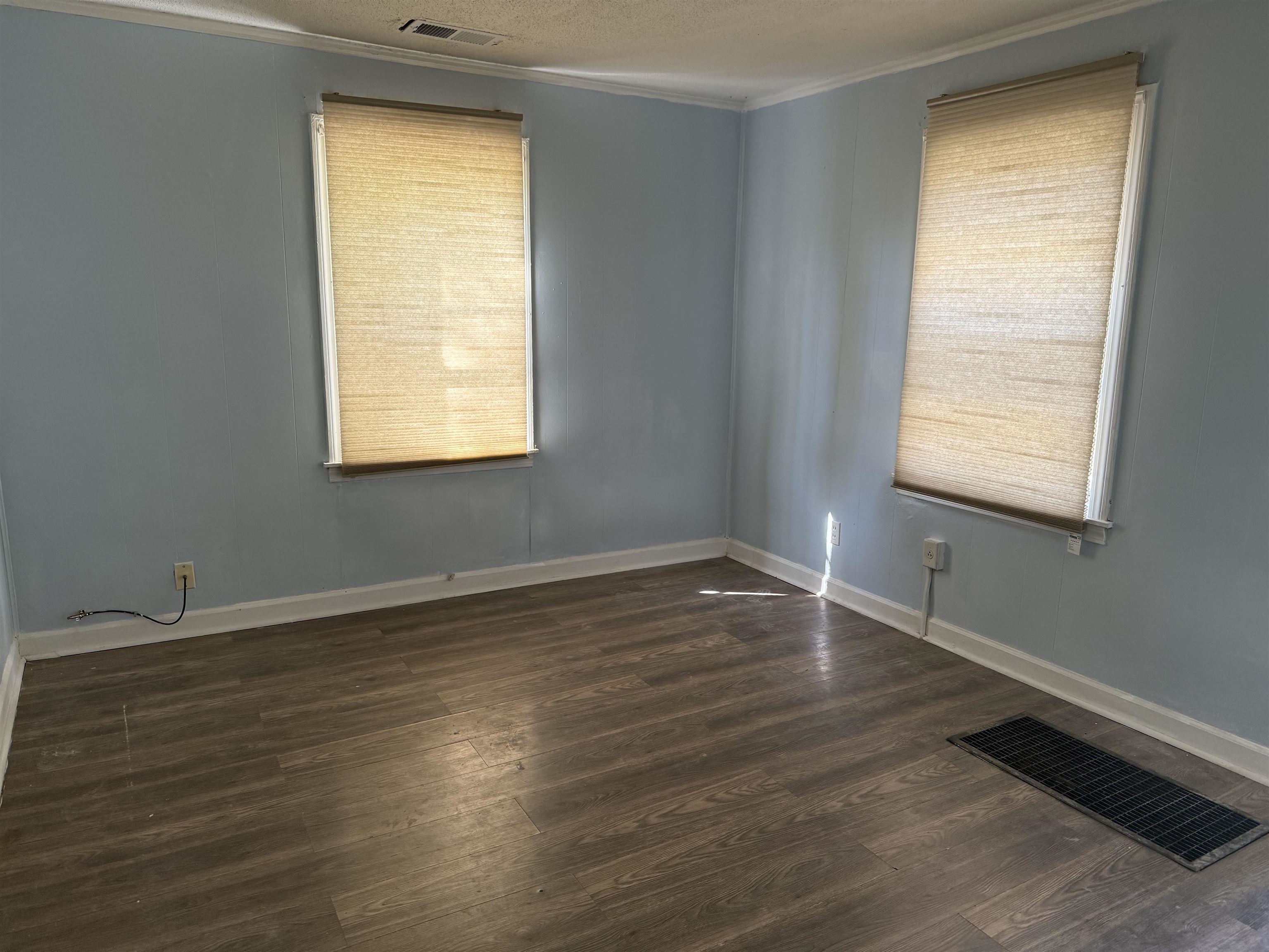 1248 Meda Street Memphis, TN 38114 - Photo 22 of 24 a view of an empty room with wooden floor and a window