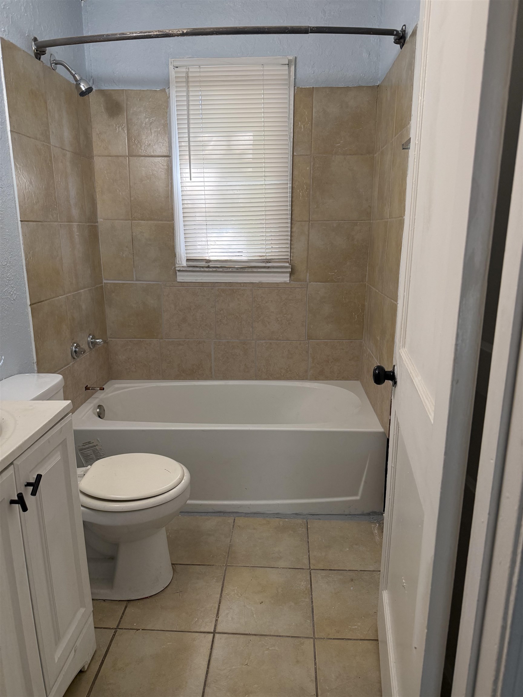 1248 Meda Street Memphis, TN 38114 - Photo 24 of 24 Bathroom featuring shower / bathtub combination, vanity, and light tile patterned flooring