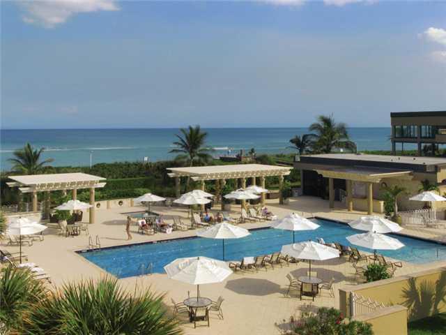 3000 Southeast Island Point Lane Stuart, FL 34996 - Photo 19 of 25 a view of a swimming pool with outdoor seating