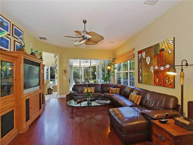 3000 Southeast Island Point Lane Stuart, FL 34996 - Photo 6 of 25 a living room with furniture fireplace and flat screen tv