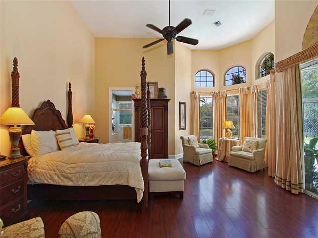 3000 Southeast Island Point Lane Stuart, FL 34996 - Photo 8 of 25 a bedroom with furniture and wooden floor