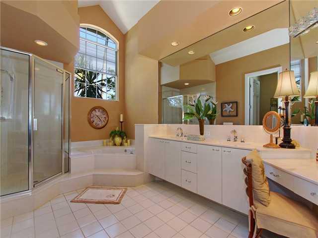 3000 Southeast Island Point Lane Stuart, FL 34996 - Photo 9 of 25 a bathroom with a sink a vanity and mirror