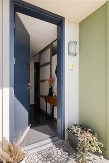 a bedroom with a bed and a dresser in it