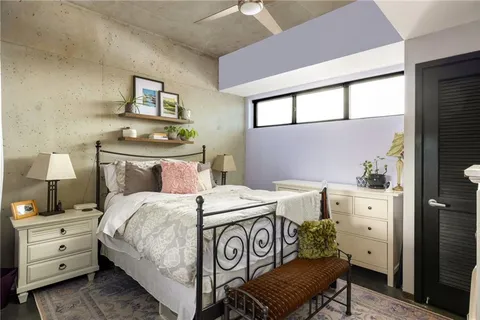 a bedroom with a bed and a dresser