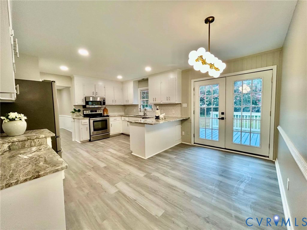 7110 Manning Road Chesterfield, VA 23832 - Photo 15 of 50 White cabinetry, stainless steel appliances, wood-