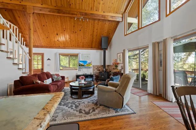 a living room with furniture window and wooden floor