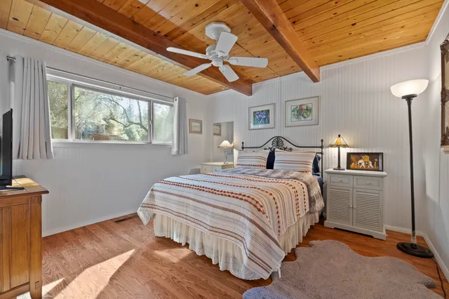 a bedroom with bed and window