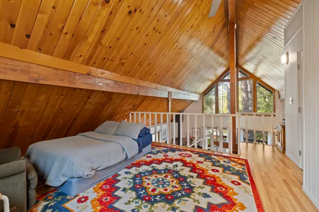 a bedroom with a bed and a table