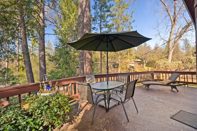 a view of chairs and table in the balcony