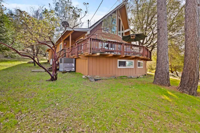 a backyard of a house with lots of green space