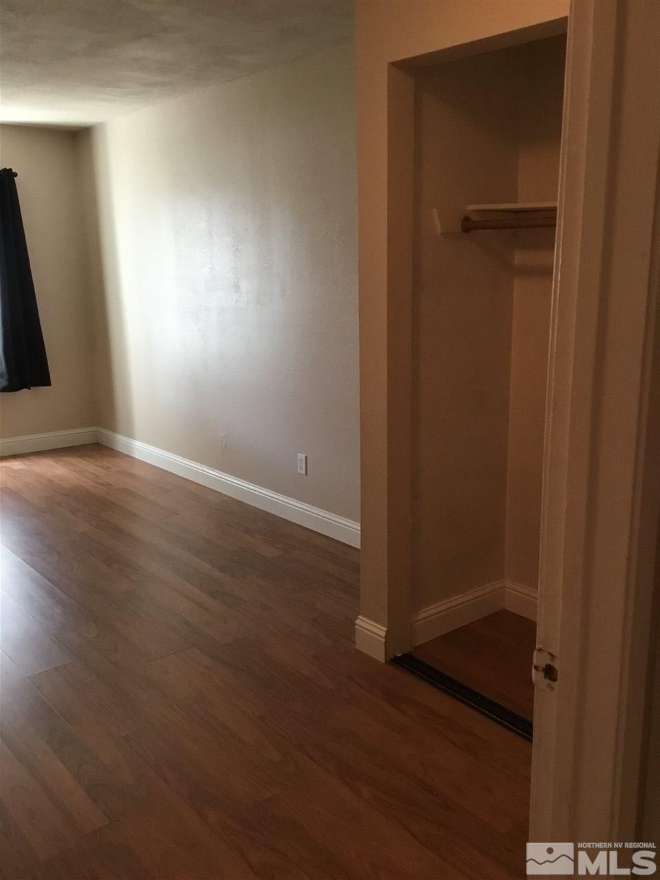 2366 Roundhouse Road Sparks, NV 89431 - Photo 10 of 13 an empty room with wooden floor and closet