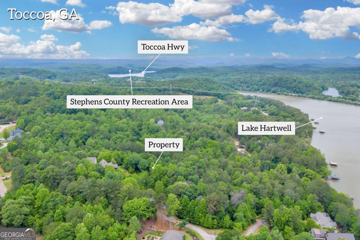 5 Edgewater Trail Toccoa, GA 30577 - Photo 7 of 12 a sign that is sitting on a brick wall