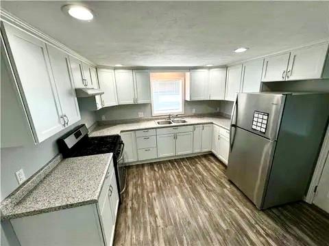 141 Shenango Road New Castle, PA 16105 - Photo 5 of 11 a kitchen with stainless steel appliances granite countertop a sink stove and refrigerator