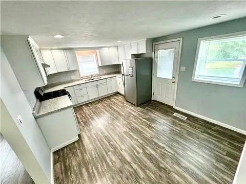 141 Shenango Road New Castle, PA 16105 - Photo 6 of 11 a kitchen with stainless steel appliances a refrigerator and a stove top oven