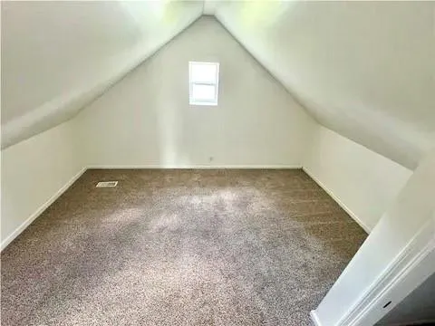 an empty room with a empty space and a window