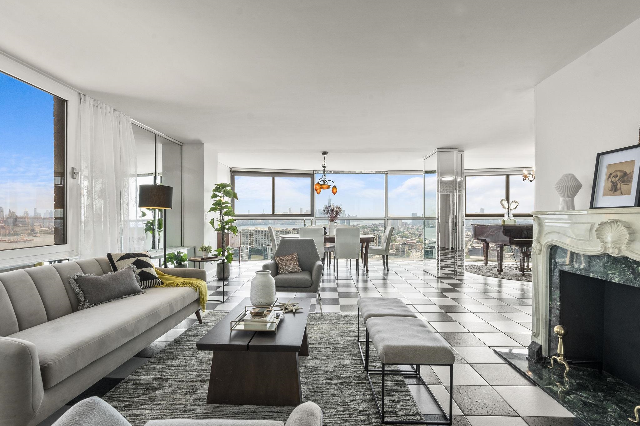380 Mountain Road, Unit 1112 Union City, NJ 07087 - Photo 1 of 42 a living room with fireplace furniture and a large window