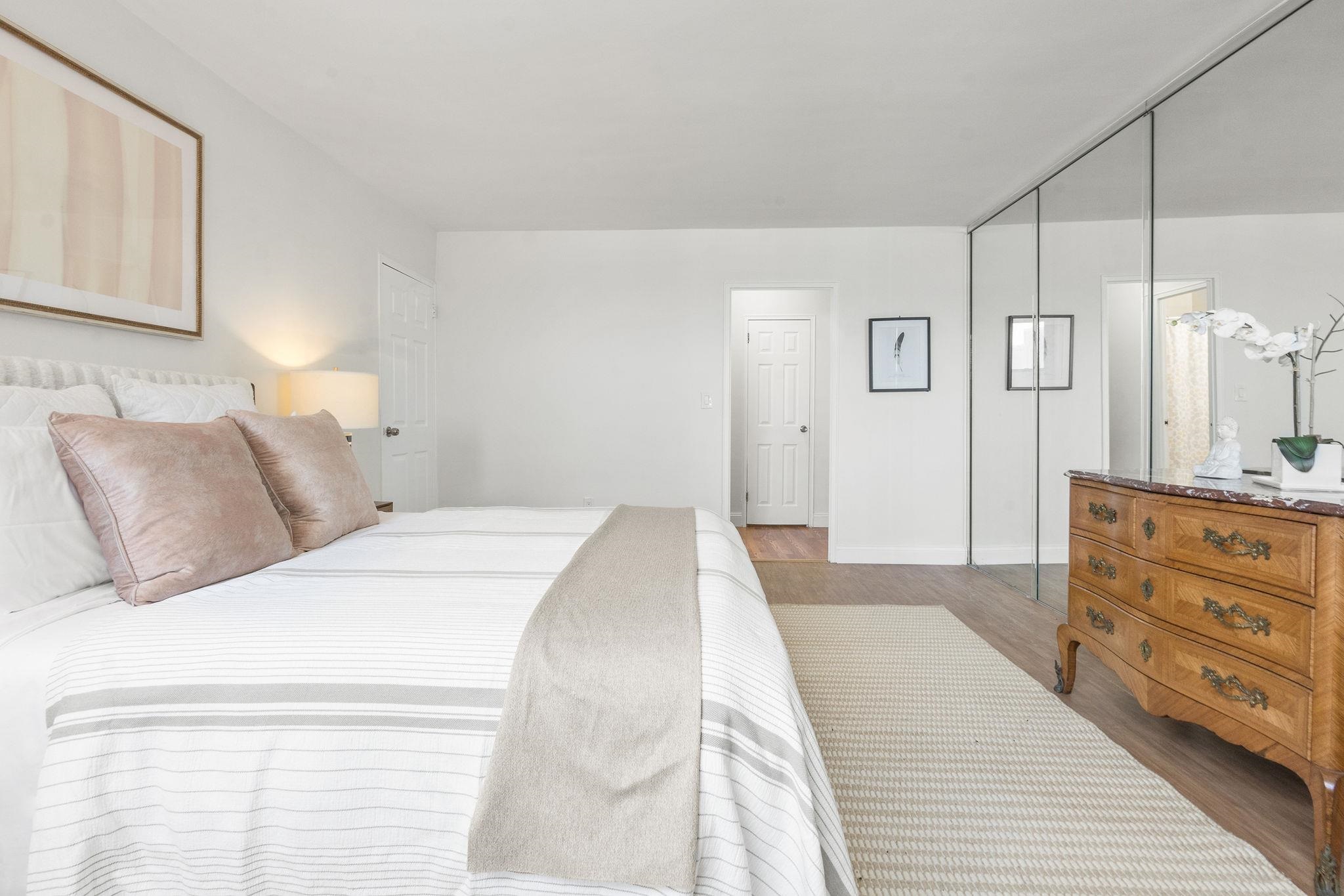 380 Mountain Road, Unit 1112 Union City, NJ 07087 - Photo 20 of 42 a bedroom with a bed and a dresser