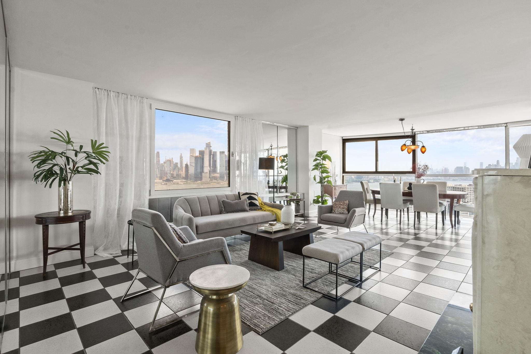 380 Mountain Road, Unit 1112 Union City, NJ 07087 - Photo 2 of 42 a living room with furniture and a potted plant