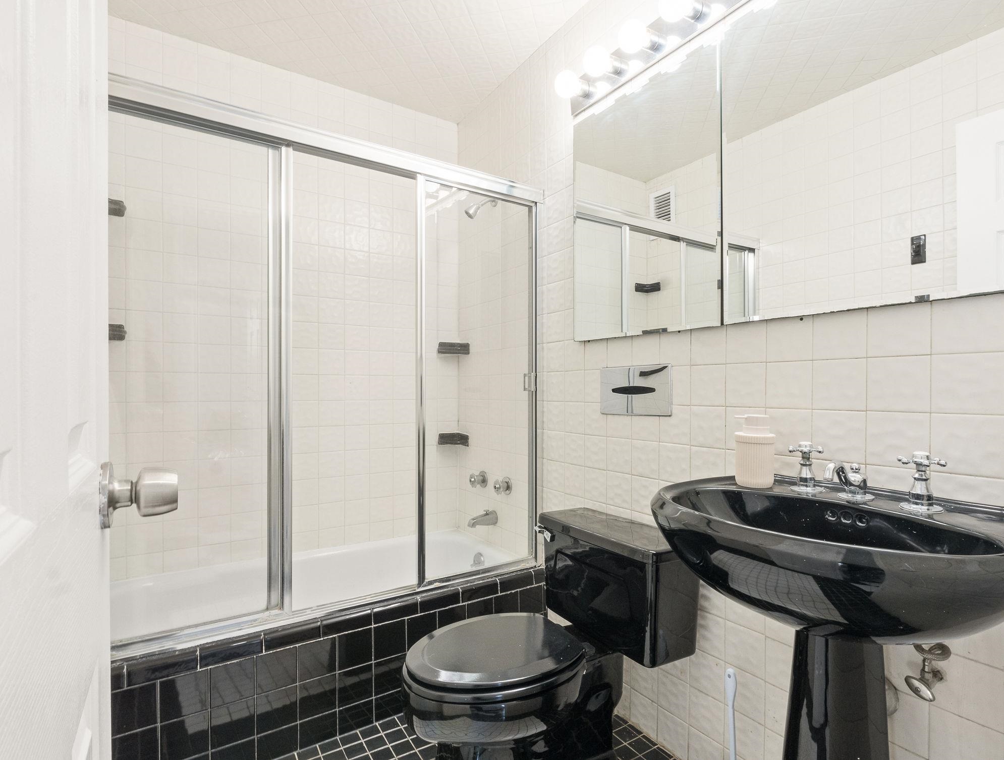 380 Mountain Road, Unit 1112 Union City, NJ 07087 - Photo 25 of 42 a bathroom with a sink a toilet and shower