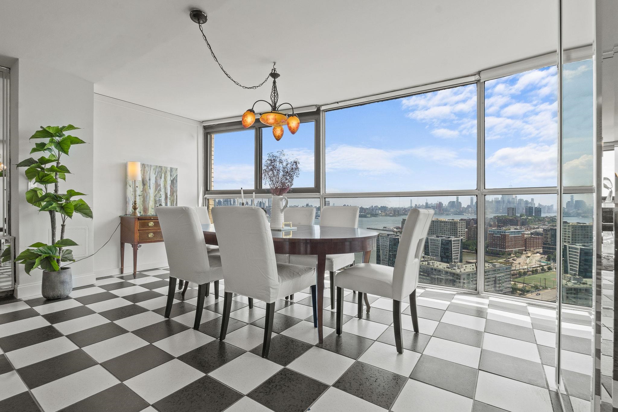 380 Mountain Road, Unit 1112 Union City, NJ 07087 - Photo 8 of 42 a view of a dining room with furniture window and outside view
