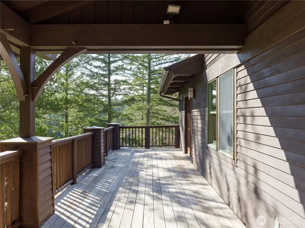 a view of balcony with wooden floor