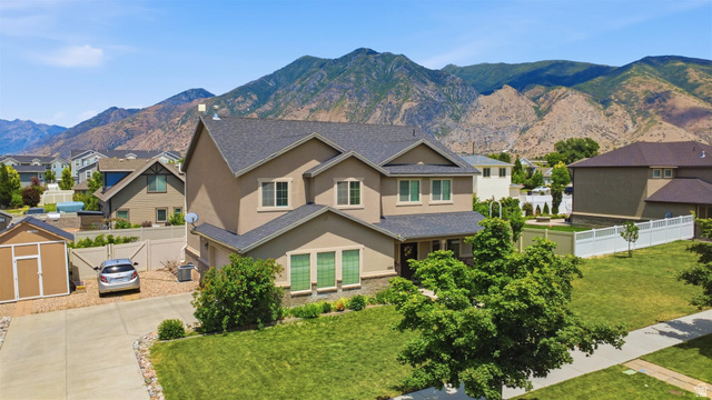 592 West 650 South Springville, UT 84663 - Photo 27 of 33 Two-story stucco home with a dark shingle roof and a stone accent facade