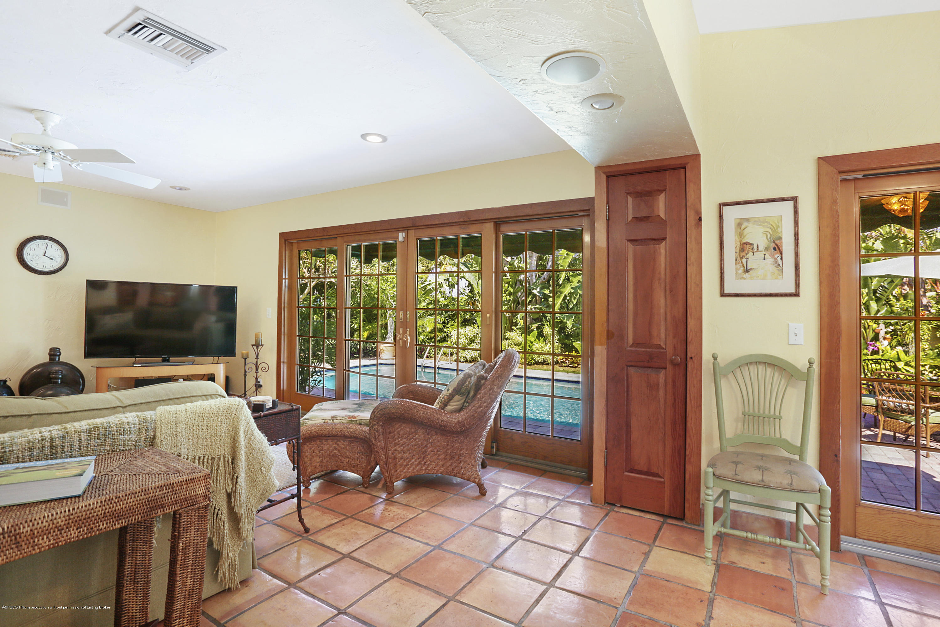 194 Almeria Road West Palm Beach, FL 33405 - Photo 15 of 25 a bedroom with furniture and a flat screen tv
