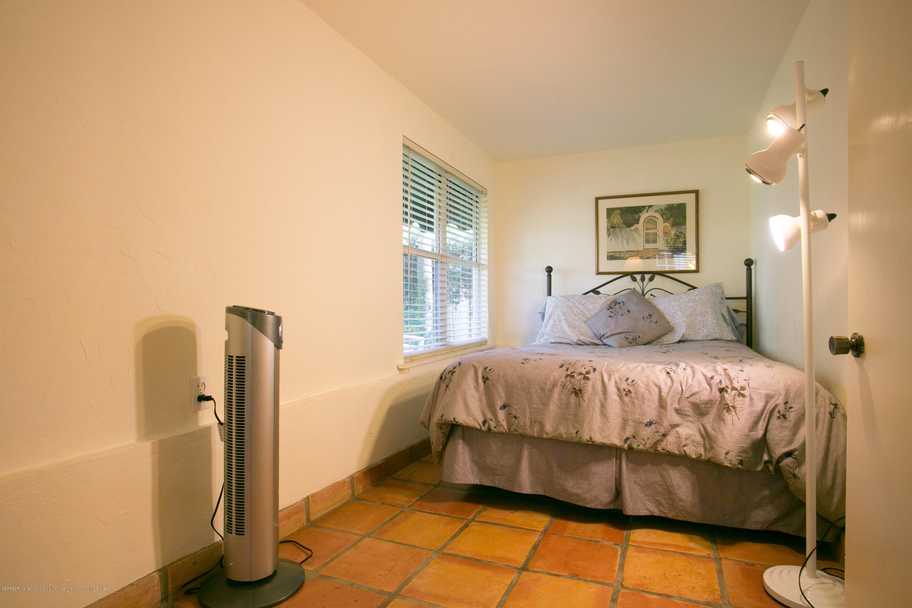 194 Almeria Road West Palm Beach, FL 33405 - Photo 20 of 25 a bedroom with a bed and a window