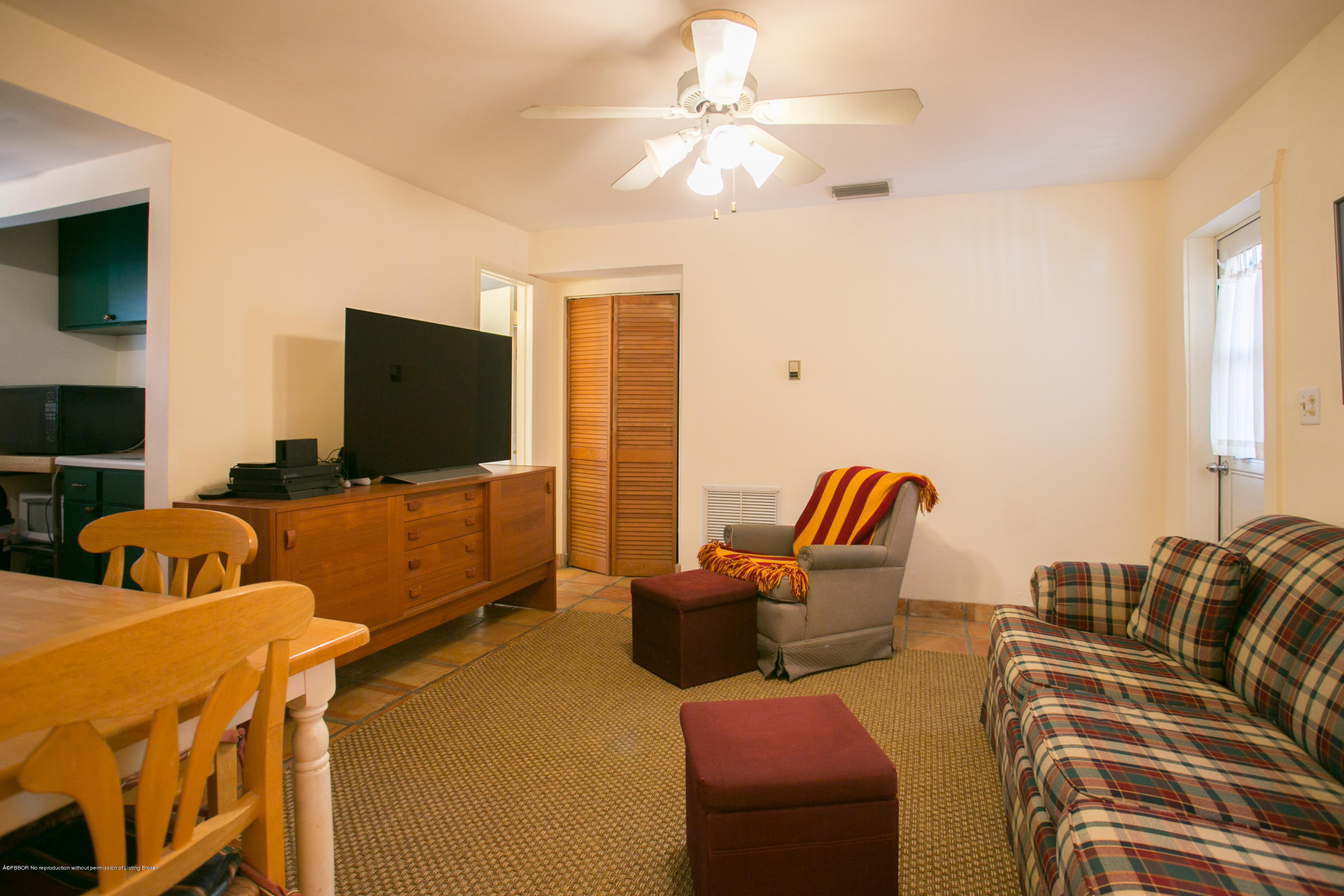 194 Almeria Road West Palm Beach, FL 33405 - Photo 22 of 25 a bedroom with furniture and a flat screen tv