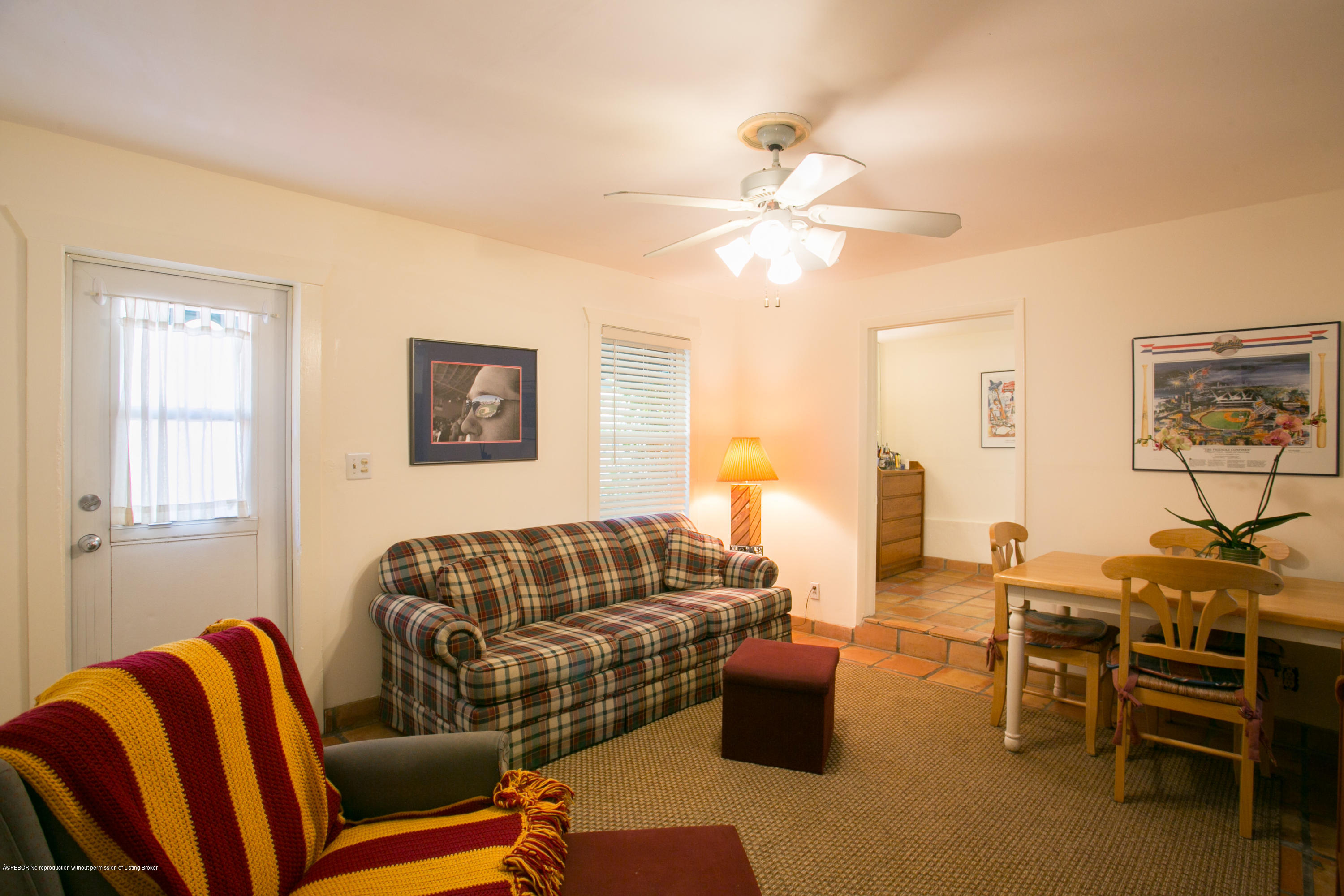 194 Almeria Road West Palm Beach, FL 33405 - Photo 23 of 25 a living room with furniture a ceiling fan and a window