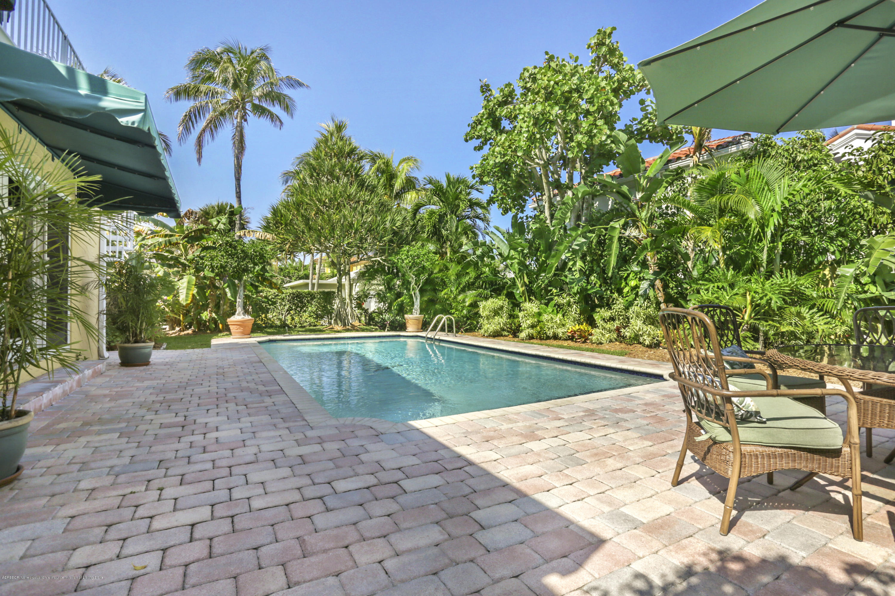 194 Almeria Road West Palm Beach, FL 33405 - Photo 24 of 25 a view of a swimming pool with a patio and a yard