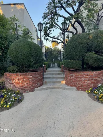 a view of street with flower plants