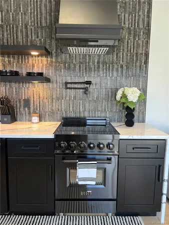 a kitchen with a stove and cabinets