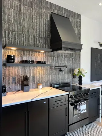 a kitchen with a sink and cabinets