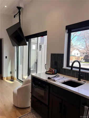 a kitchen with a sink and a large window