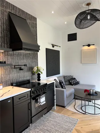 a kitchen with a sink stove and cabinets