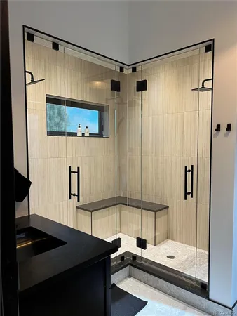 a bathroom with a shower and a sink