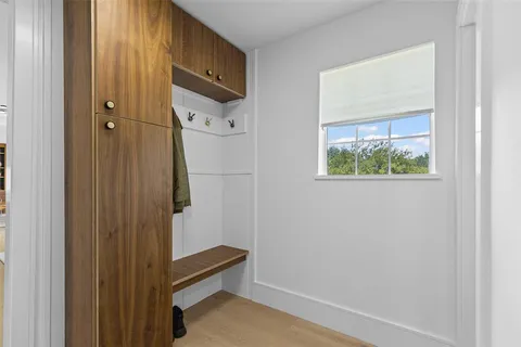 a bathroom with a shower and a window