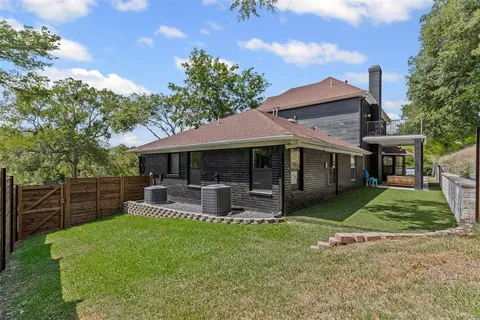 a view of a house with a yard porch and sitting area