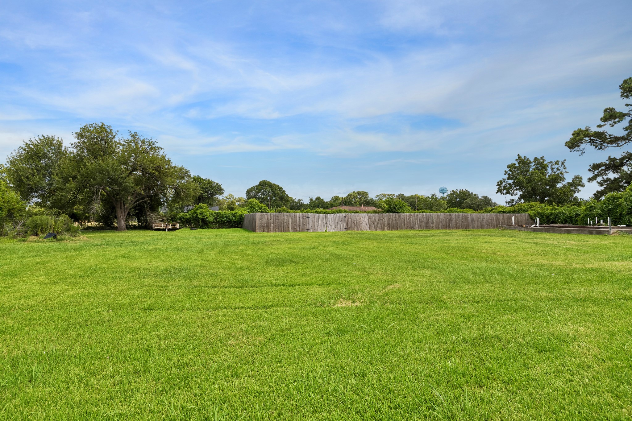 2013 Ellis School Road Baytown, TX 77521 - Photo 5 of 31 Exterior view behind the buildings, highlighting the property’s clean presentation and functional layout.
