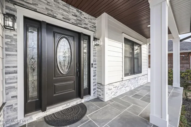 a view of a door of a house with a door and a outdoor space